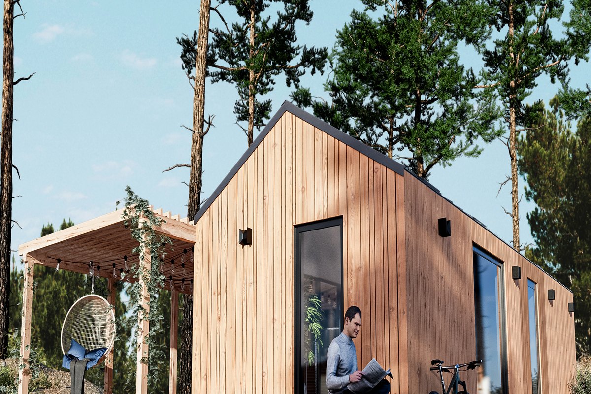 LE TinyHouse Haven: Holzfassade mit Satteldach, Holzterrasse und Pergola zwischen Kiefern
